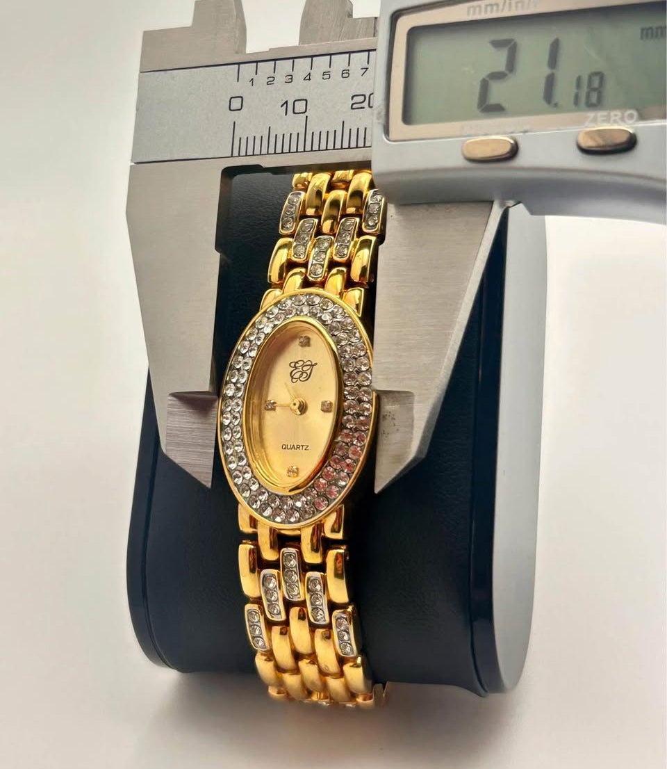 Vintage Elizabeth Taylor Rhinestone Watch gold tone, 21mm size case, 7.5in size wrist bracelet.