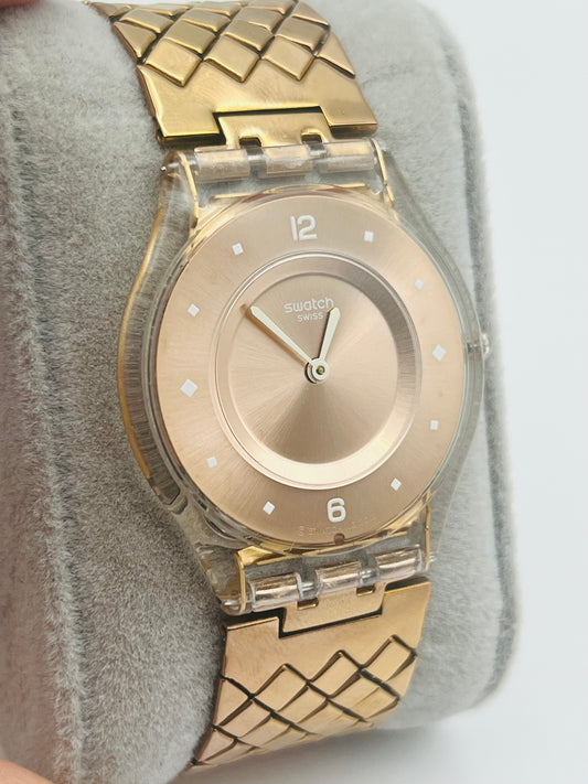 Swatch gold tone very thin watch