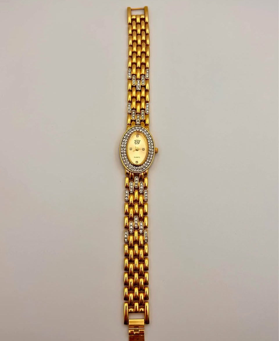 Vintage Elizabeth Taylor Rhinestone Watch gold tone, 21mm size case, 7.5in size wrist bracelet.
