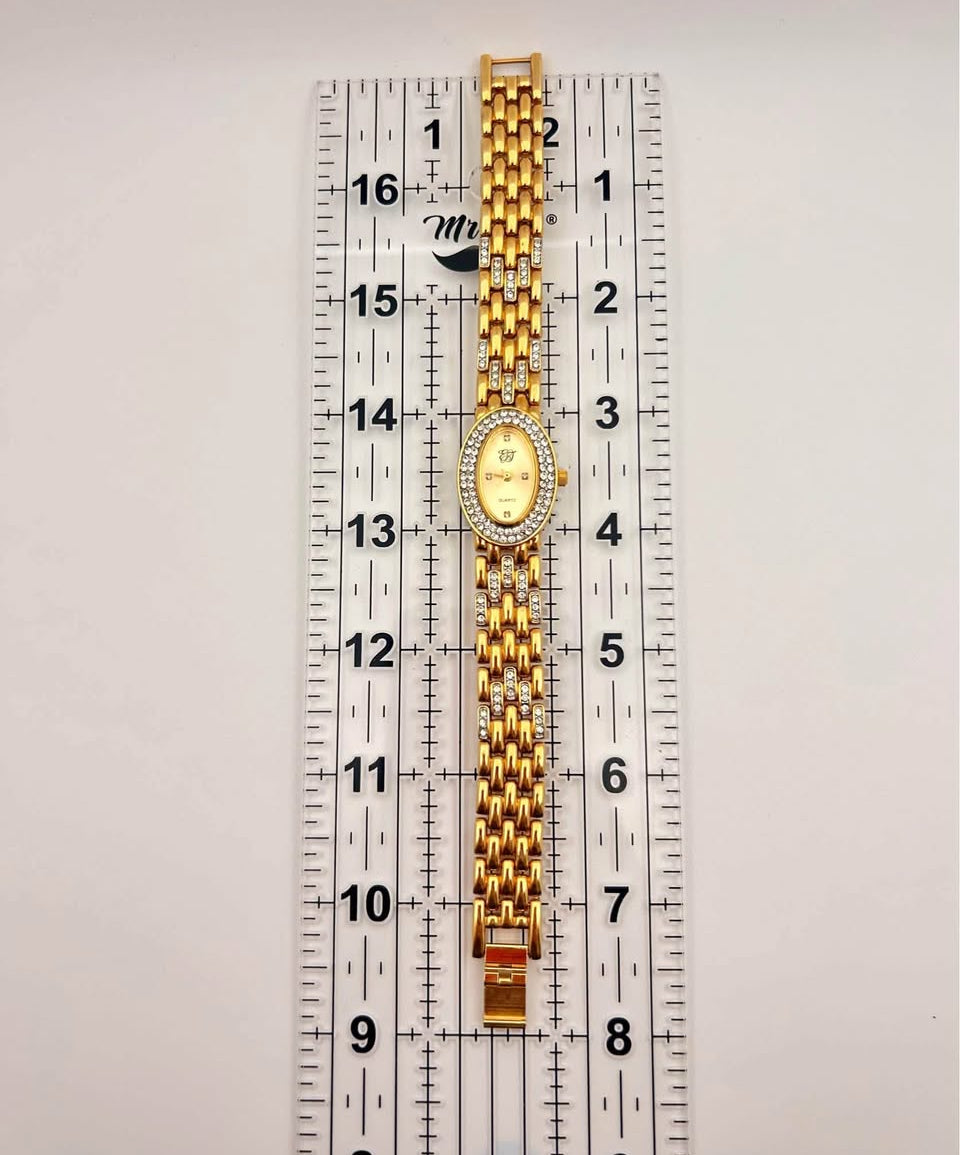 Vintage Elizabeth Taylor Rhinestone Watch gold tone, 21mm size case, 7.5in size wrist bracelet.