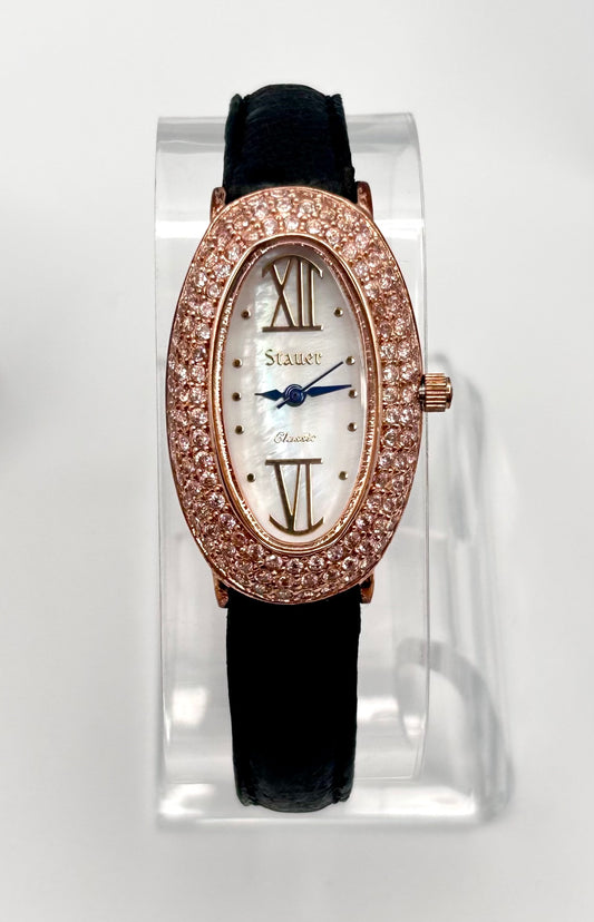 Stauer rose gold tone watch, 22mm size case, 7in size band.
