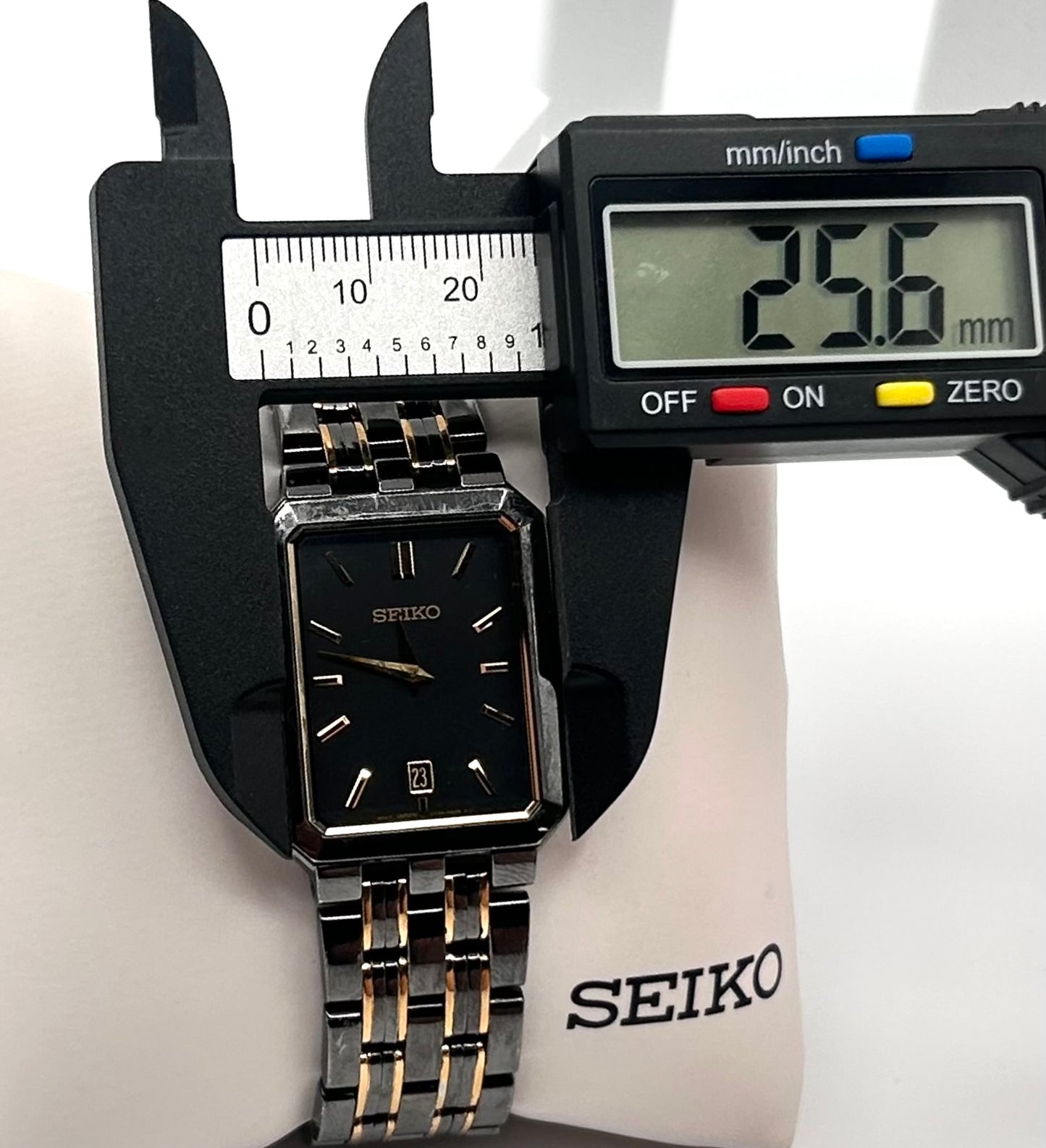 Vintage 1990 Seiko  black and gold tone watch 25mm size case, 6.5in size wrist bracelet.