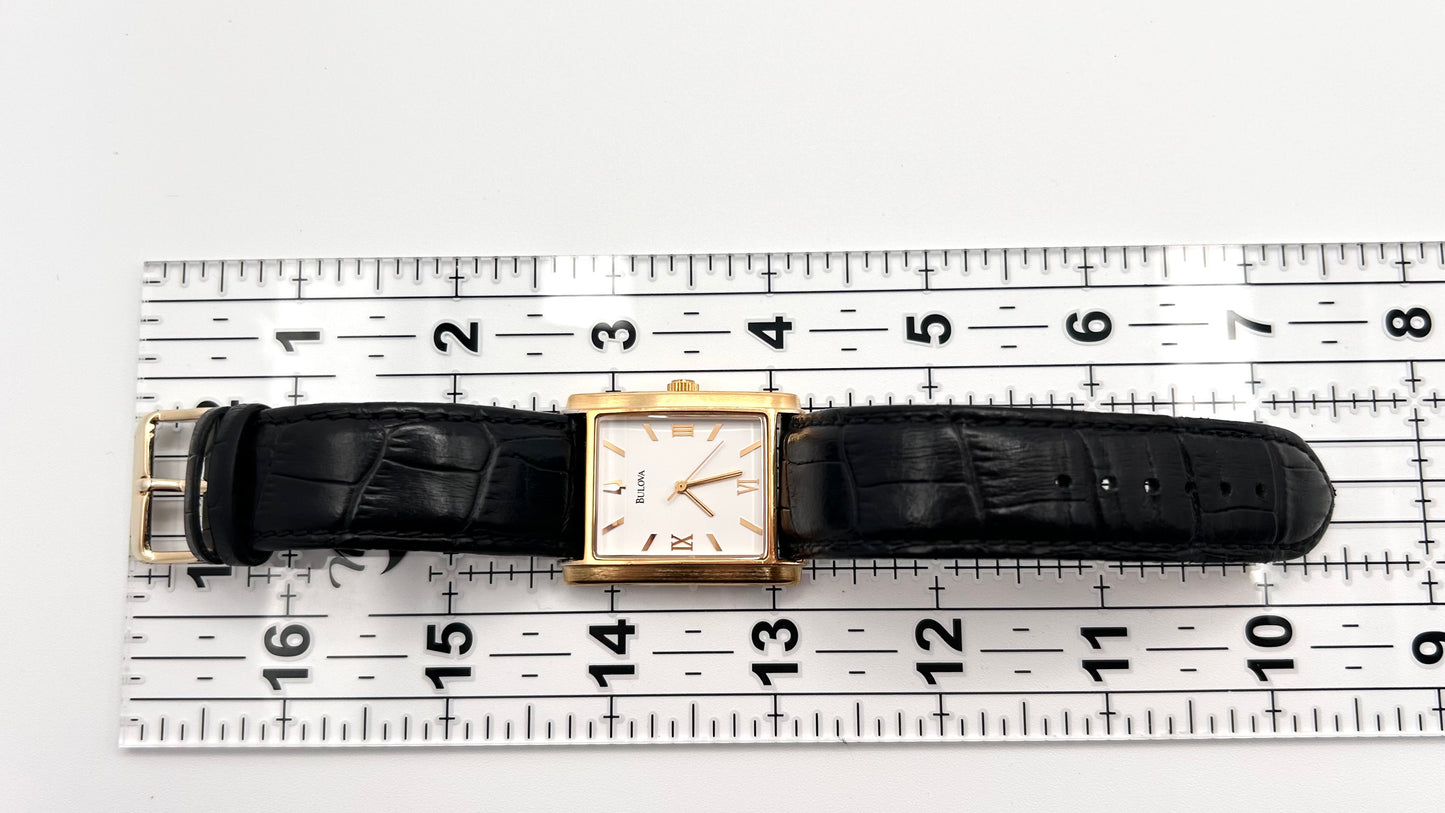 Bulova watch gold tone, 30mm size case, 7.5in size wrist leather band