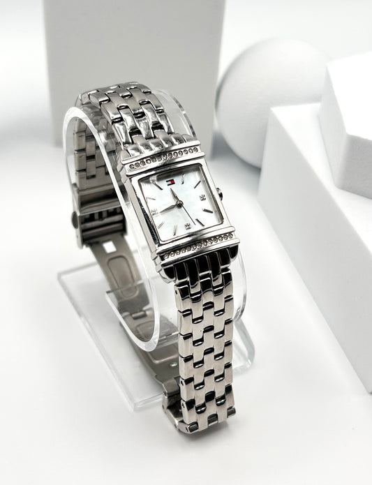 Tommy Hilfiger women watch, 22mm size case, 6.5 size wrist bracelet.