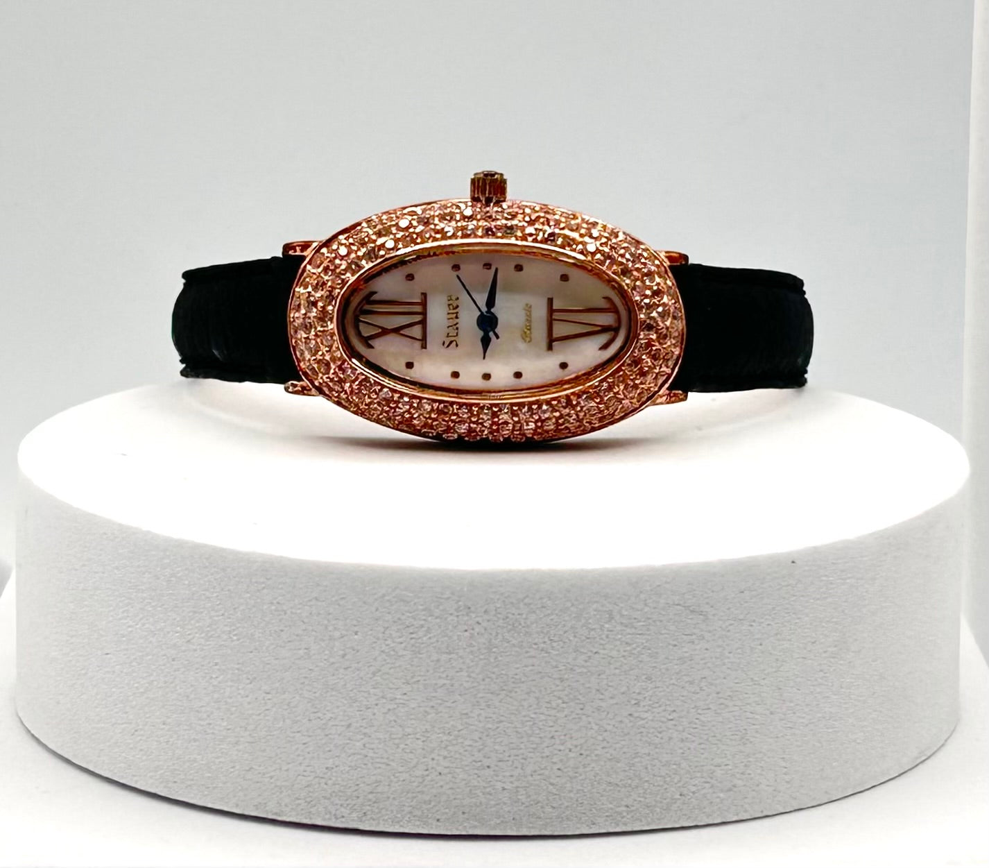 Stauer rose gold tone watch, 22mm size case, 7in size band.
