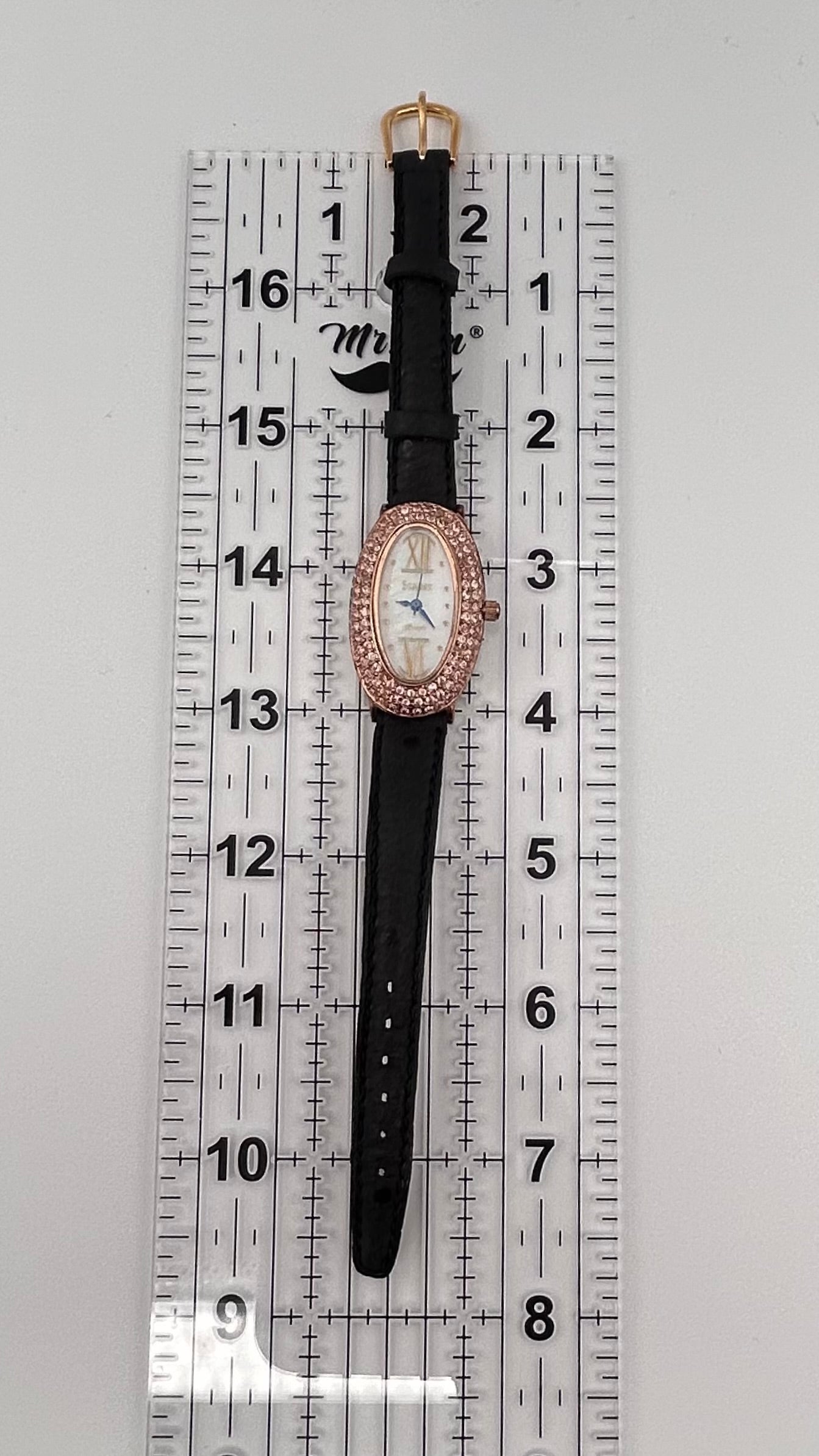 Stauer rose gold tone watch, 22mm size case, 7in size band.